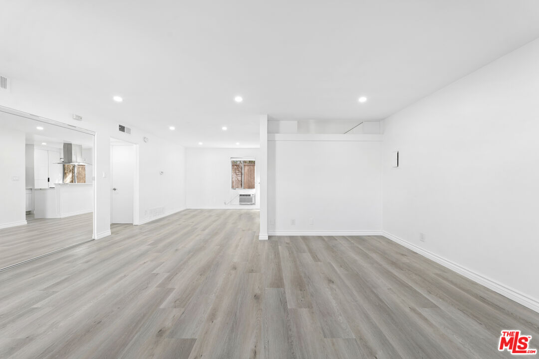 825 16th Street, Unit B Santa Monica, CA 90403 - Photo 9 of 15 a view of an empty room with wooden floor
