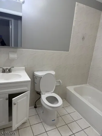 a bathroom with a sink a toilet and bathtub