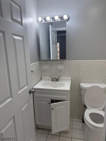 535 South 18th Street Newark, NJ 07103 - Photo 17 of 17 a bathroom with a toilet sink and mirror