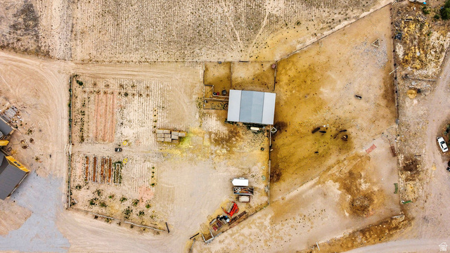 544 East 600 North, Unit 1 Joseph, UT 84739 - Photo 60 of 65 Expansive property featuring an agricultural area with tilled garden beds, a large outbuilding with a metal roof, and fenced perimeter