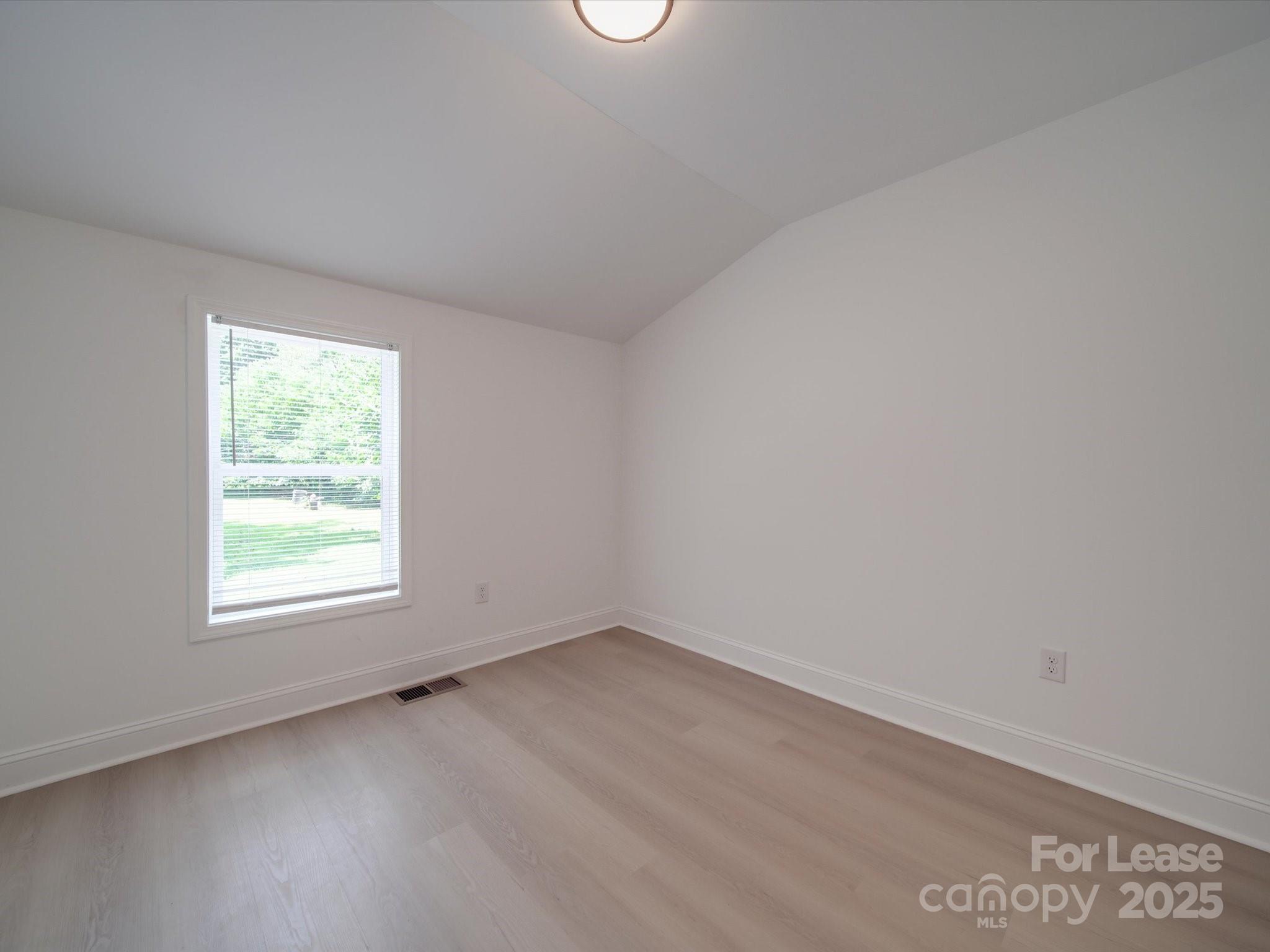 1012 Wood Street Albemarle, NC 28001 - Photo 11 of 31 an empty room with a window