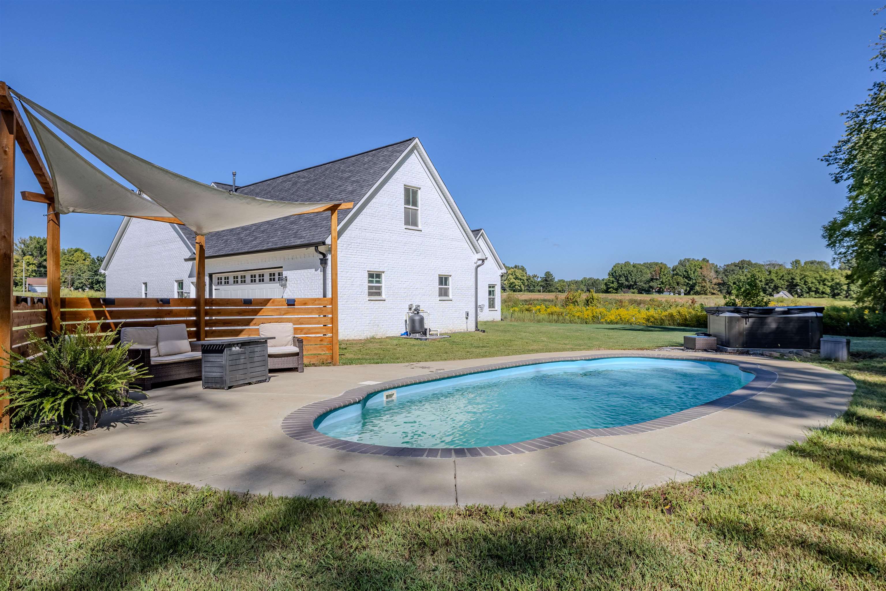 3090 Marshall Road Munford, TN 38058 - Photo 15 of 27 Outdoor pool with a yard, a patio, an outdoor living space, and a hot tub