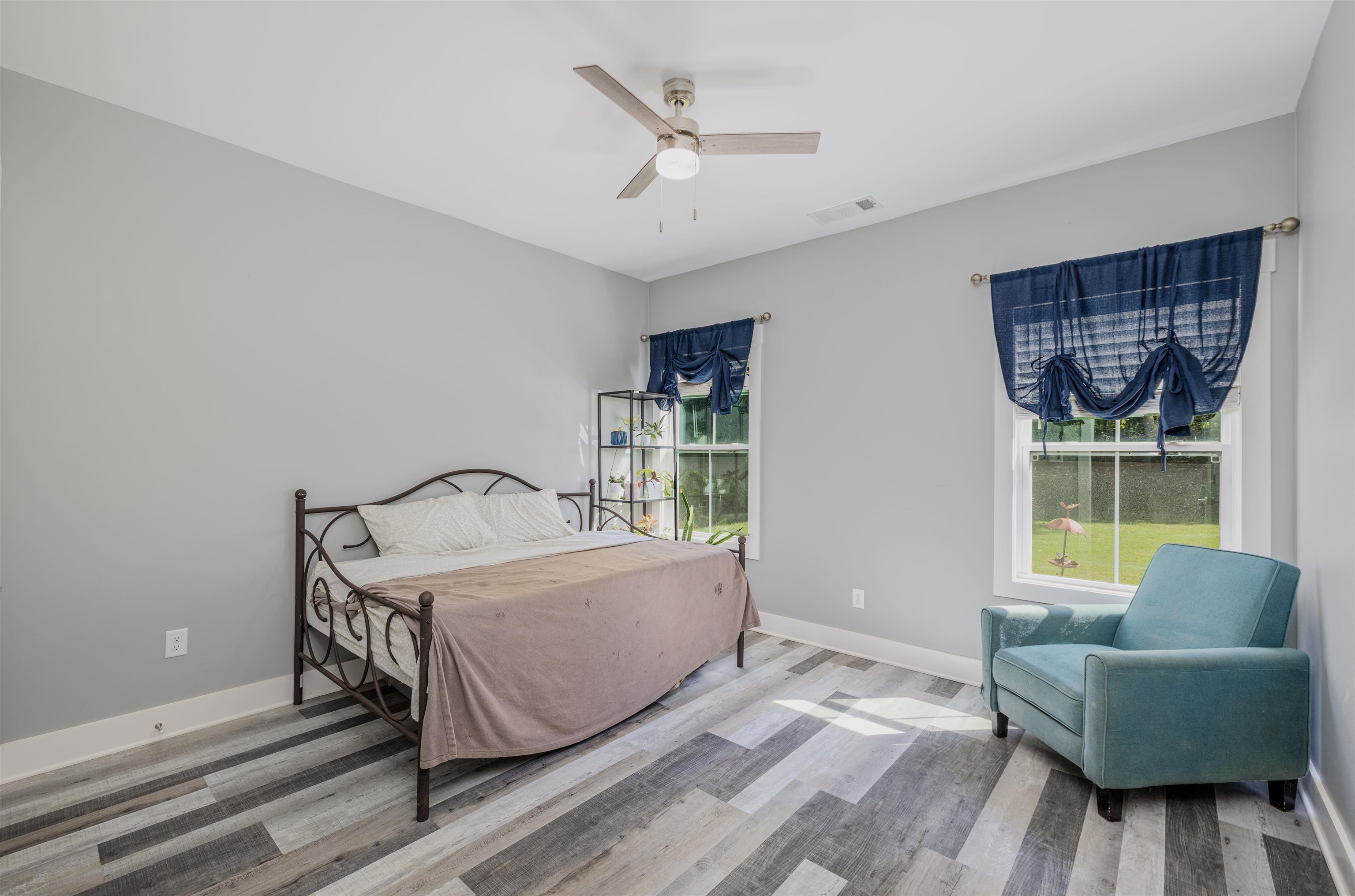 3090 Marshall Road Munford, TN 38058 - Photo 20 of 27 Bedroom with light wood finished floors and ceiling fan