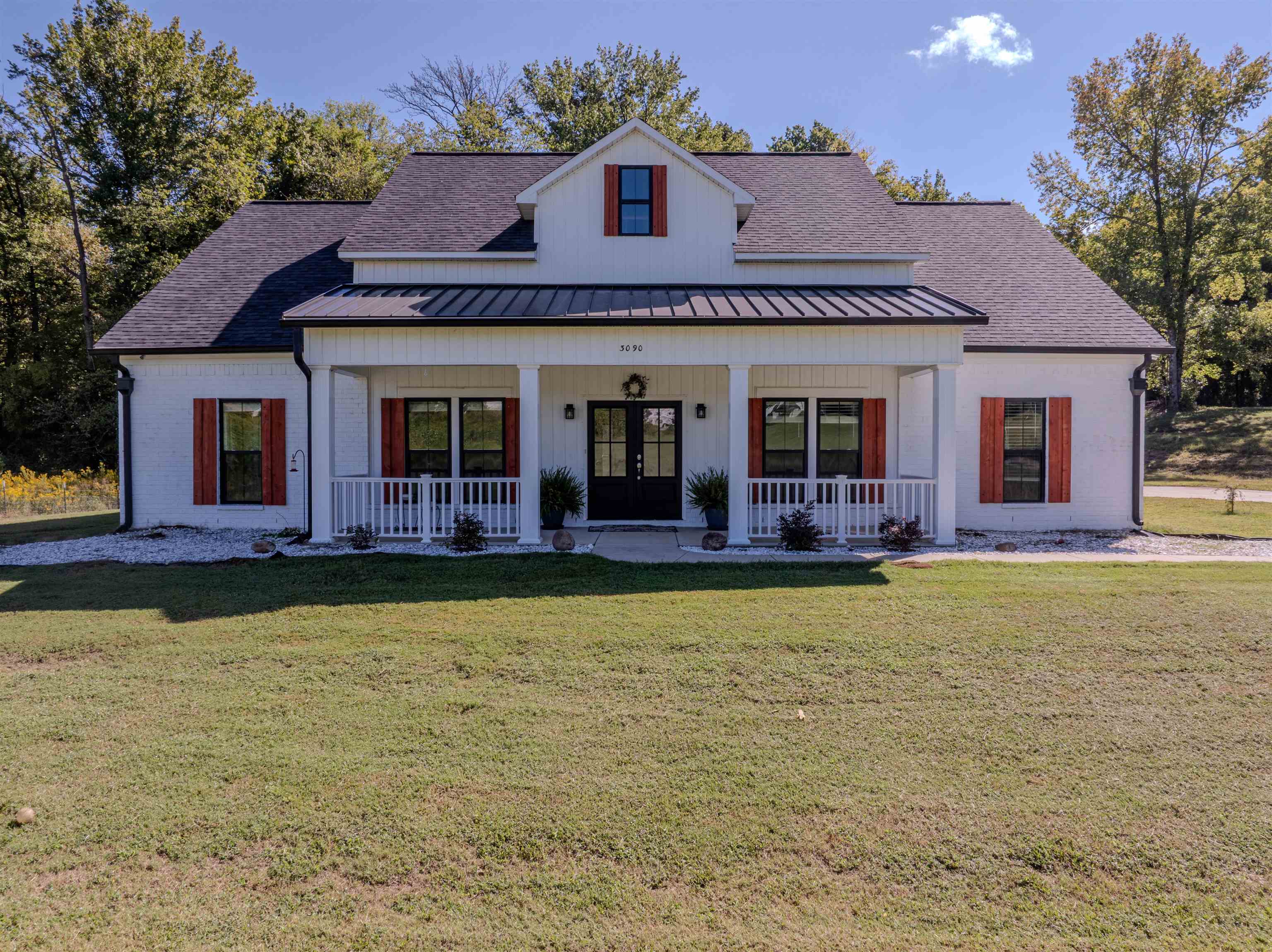 3090 Marshall Road Munford, TN 38058 - Photo 2 of 27 a front view of a house with swimming pool
