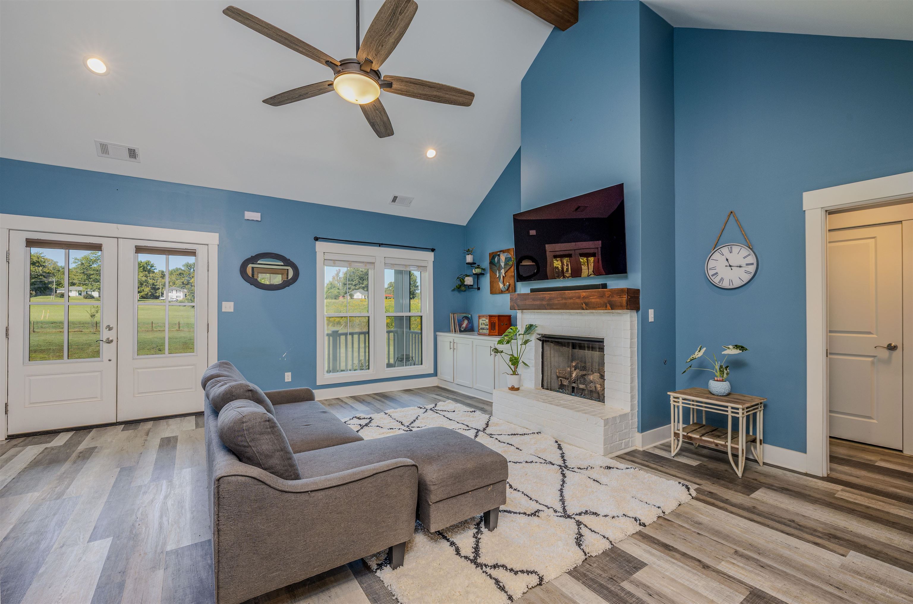 3090 Marshall Road Munford, TN 38058 - Photo 4 of 27 a living room with furniture a fireplace and a flat screen tv