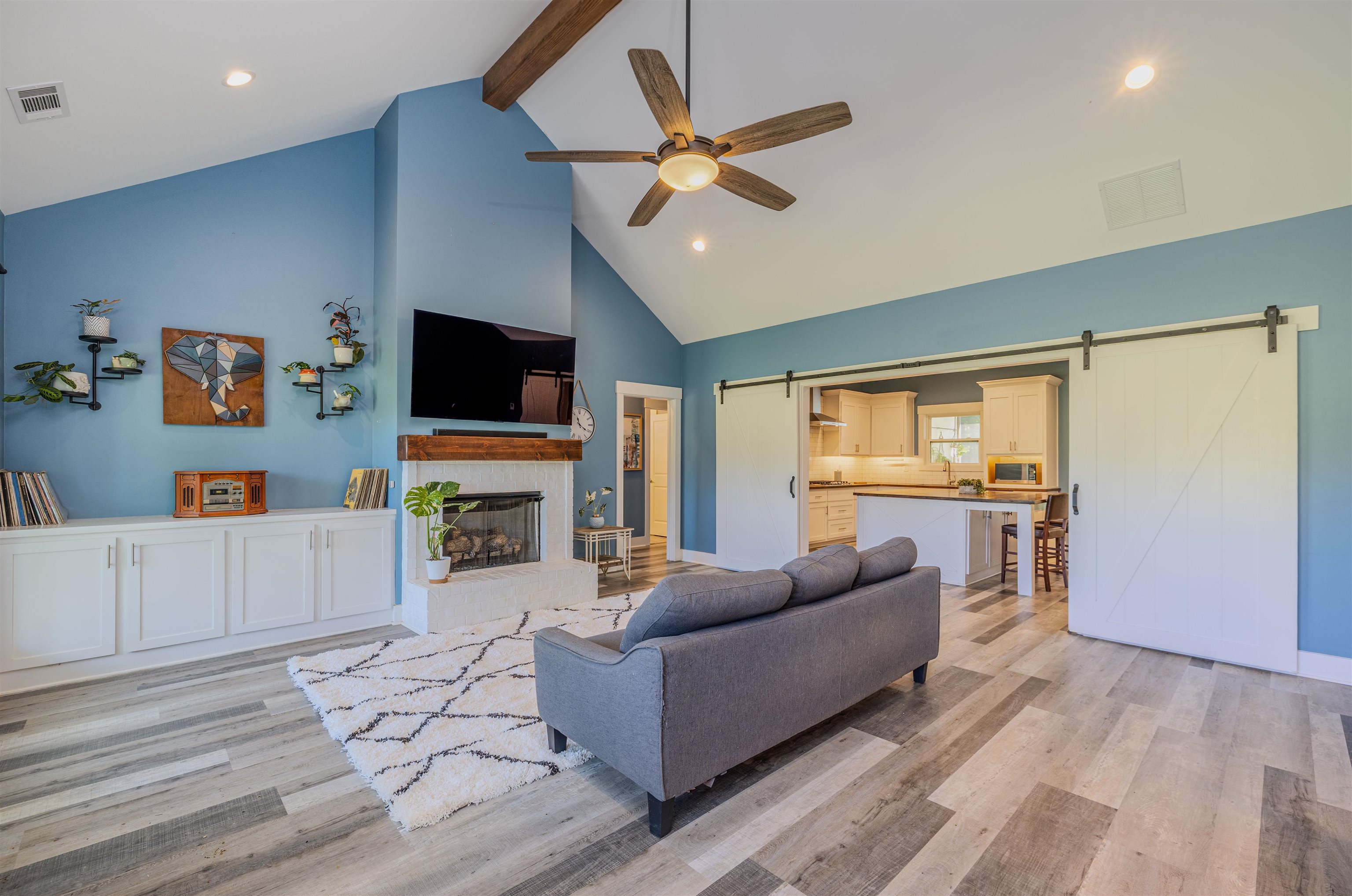 3090 Marshall Road Munford, TN 38058 - Photo 5 of 27 a living room with furniture a fireplace and a flat screen tv