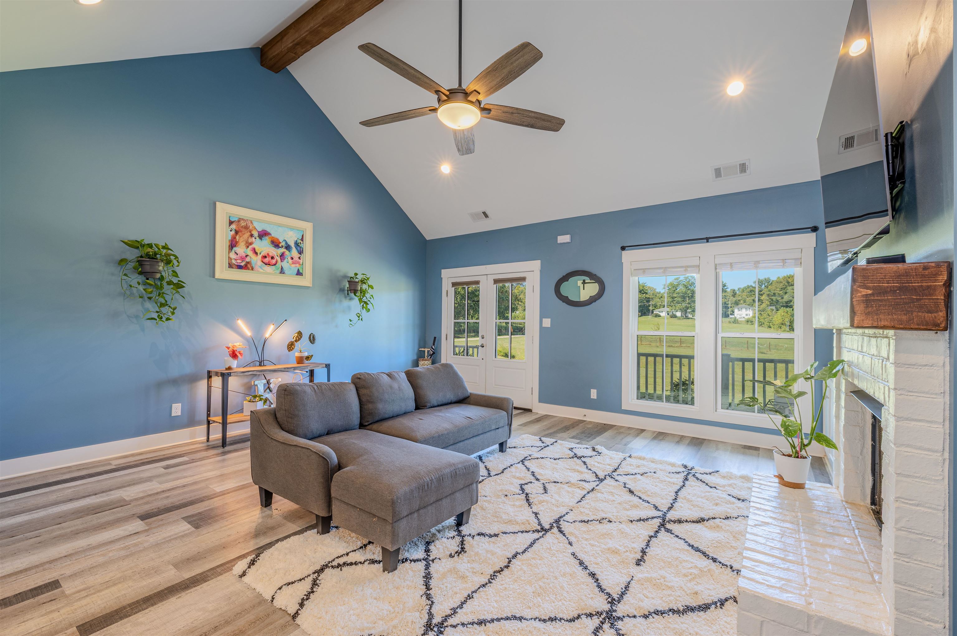 3090 Marshall Road Munford, TN 38058 - Photo 6 of 27 Living area featuring recessed lighting, light wood-style flooring, a ceiling fan, a brick fireplace, and french doors