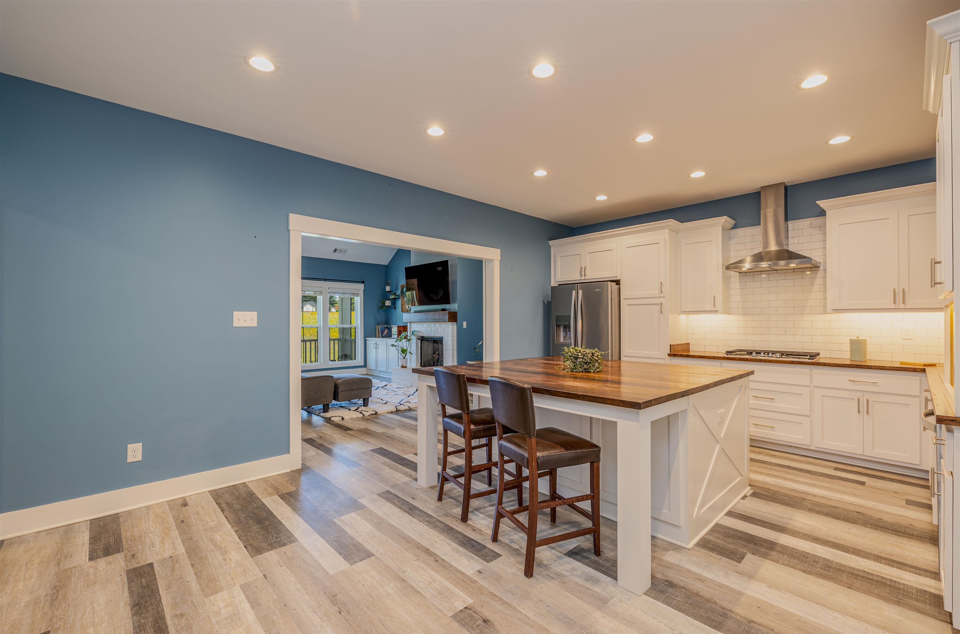 3090 Marshall Road Munford, TN 38058 - Photo 8 of 27 Kitchen with butcher block countertops, recessed lighting, white cabinets, stainless steel appliances, and decorative backsplash