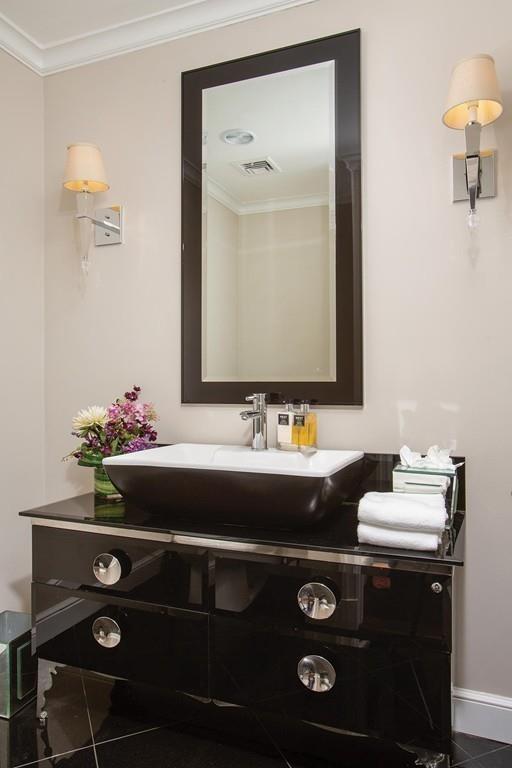 101 Blake Road Brookline, MA 02445 - Photo 15 of 28 a bathroom with a sink and a mirror