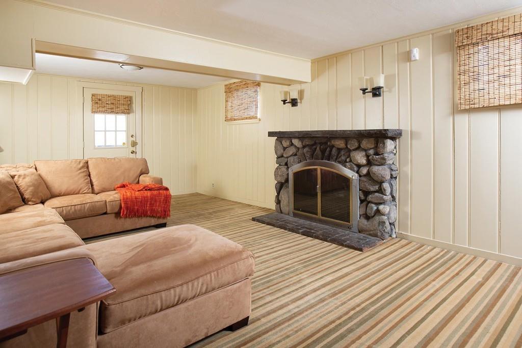 101 Blake Road Brookline, MA 02445 - Photo 22 of 28 a bedroom with a bed and a fireplace