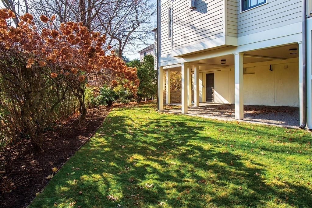 101 Blake Road Brookline, MA 02445 - Photo 24 of 28 front view of a house with a yard