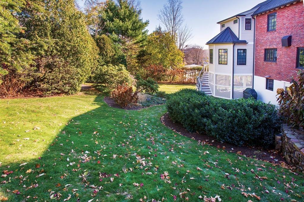101 Blake Road Brookline, MA 02445 - Photo 25 of 28 a view of a house with a yard