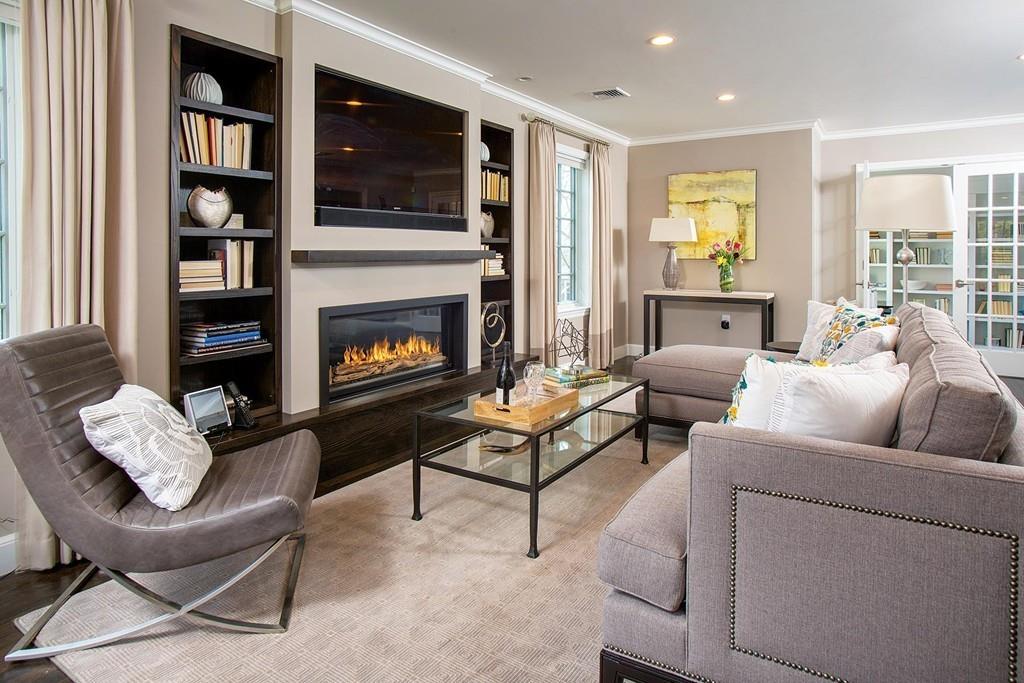 101 Blake Road Brookline, MA 02445 - Photo 4 of 28 a living room with furniture and a fireplace