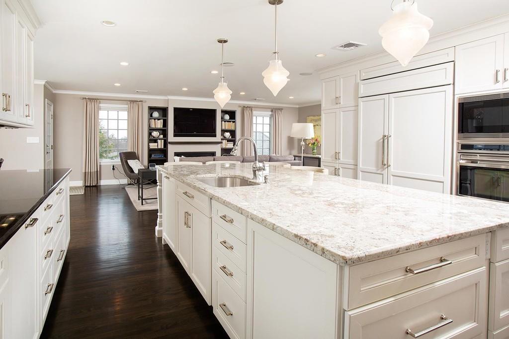 101 Blake Road Brookline, MA 02445 - Photo 9 of 28 a large kitchen with kitchen island a large island in it