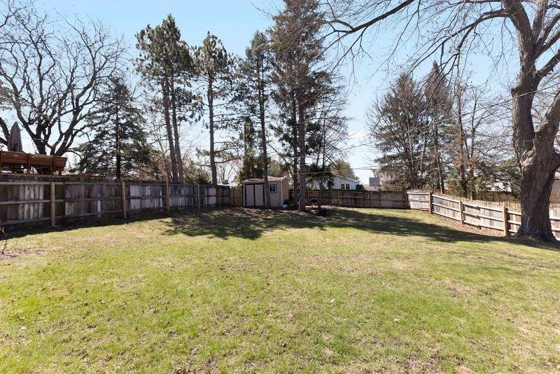 4893 Braewild Road Rockford, IL 61107 - Photo 20 of 21 a view of yard with swimming pool and trees