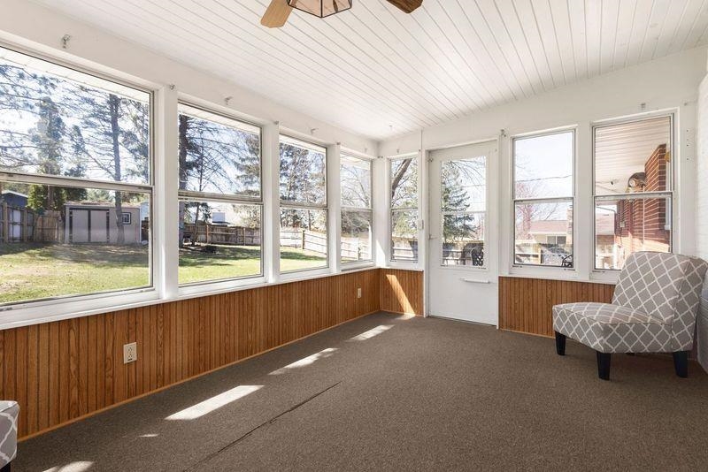 4893 Braewild Road Rockford, IL 61107 - Photo 7 of 21 a spacious bedroom with a large bed and a large window