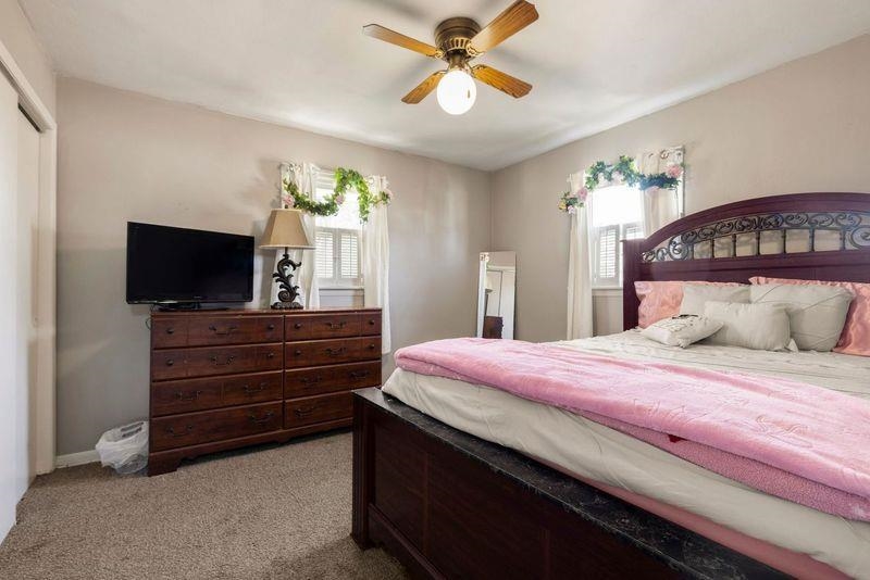 4893 Braewild Road Rockford, IL 61107 - Photo 8 of 21 a bedroom with a bed and a flat screen tv