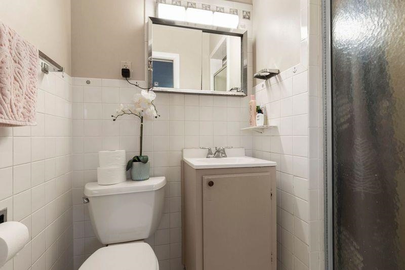 4893 Braewild Road Rockford, IL 61107 - Photo 9 of 21 a bathroom with a toilet sink and mirror