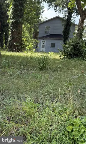 a brick house with a yard