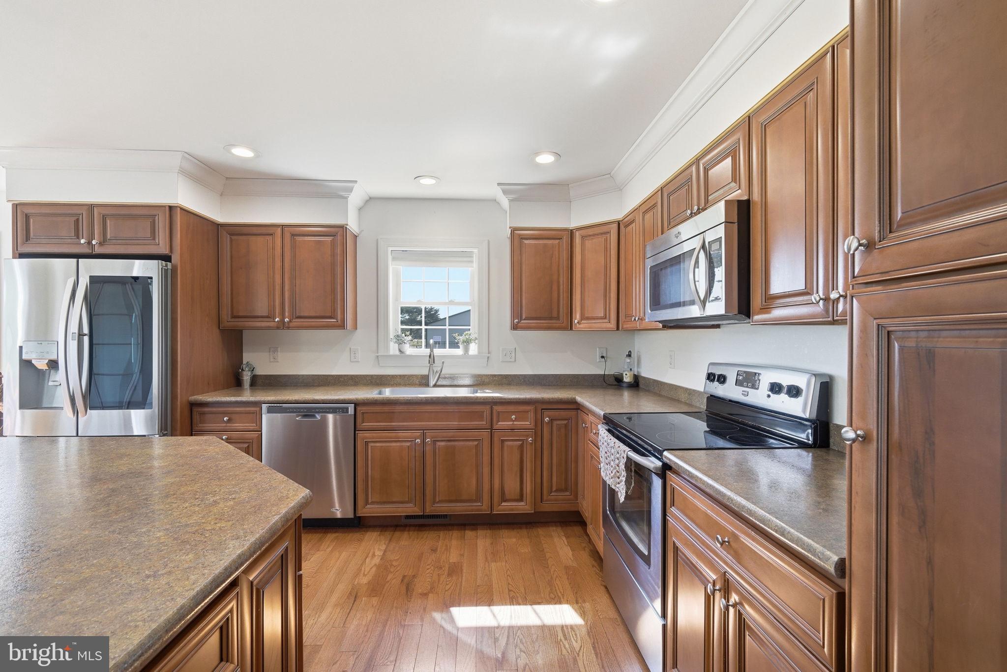 615 Ell Downes Road Henderson, MD 21640 - Photo 7 of 58 Warm wood tones in a modern kitchen.