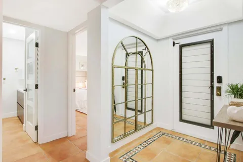 a view of an entryway with wooden floor