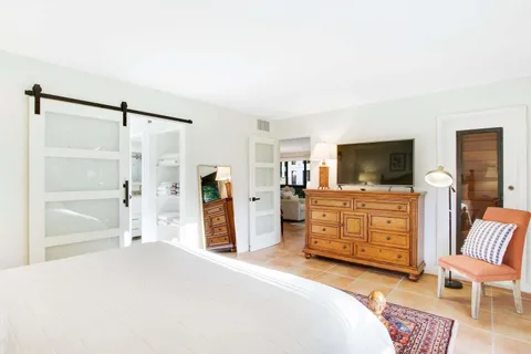 a bedroom with a bed and furniture