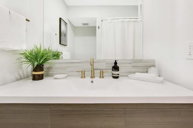 a bathroom with a double vanity sink