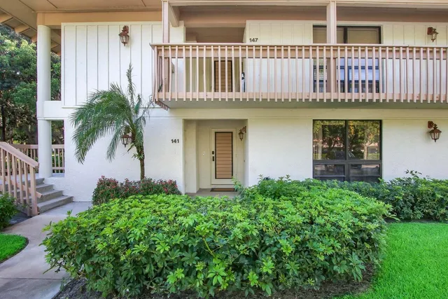 a house with swimming pool in front of it