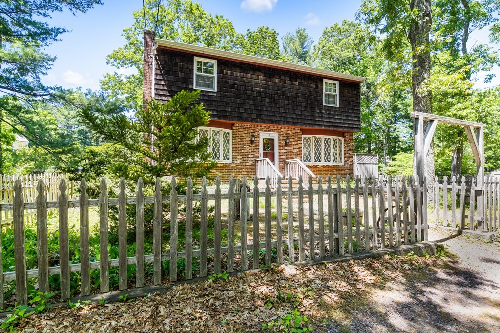 5 Hazelwood Drive Hingham, MA 02043 - Photo 2 of 12 a front view of a house with a garden
