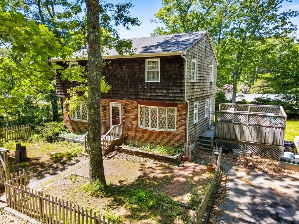 5 Hazelwood Drive Hingham, MA 02043 - Photo 4 of 12 a front view of a house with garden