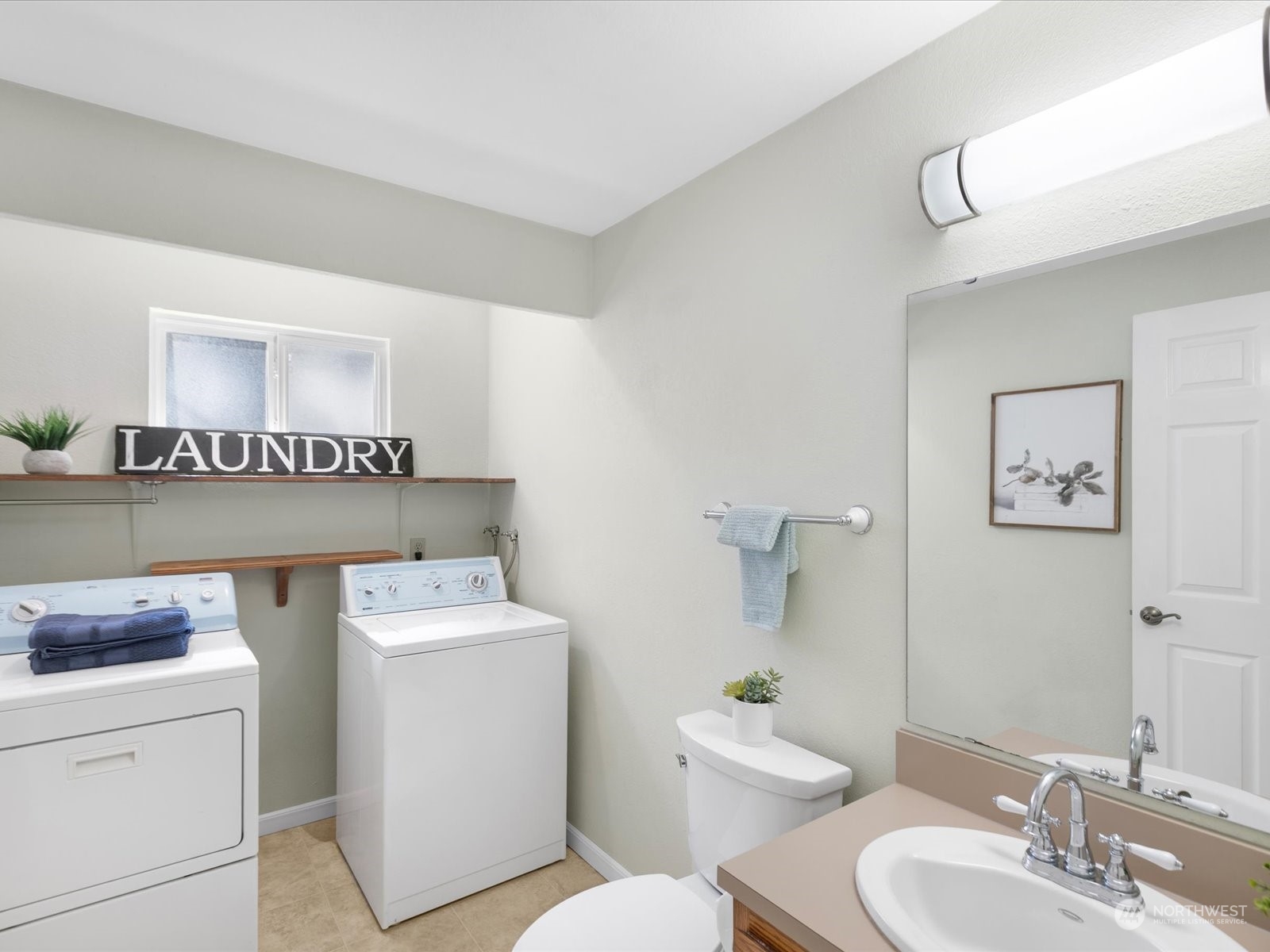 19124 27th Drive Southeast Bothell, WA 98012 - Photo 14 of 35 a bathroom with a toilet sink and mirror