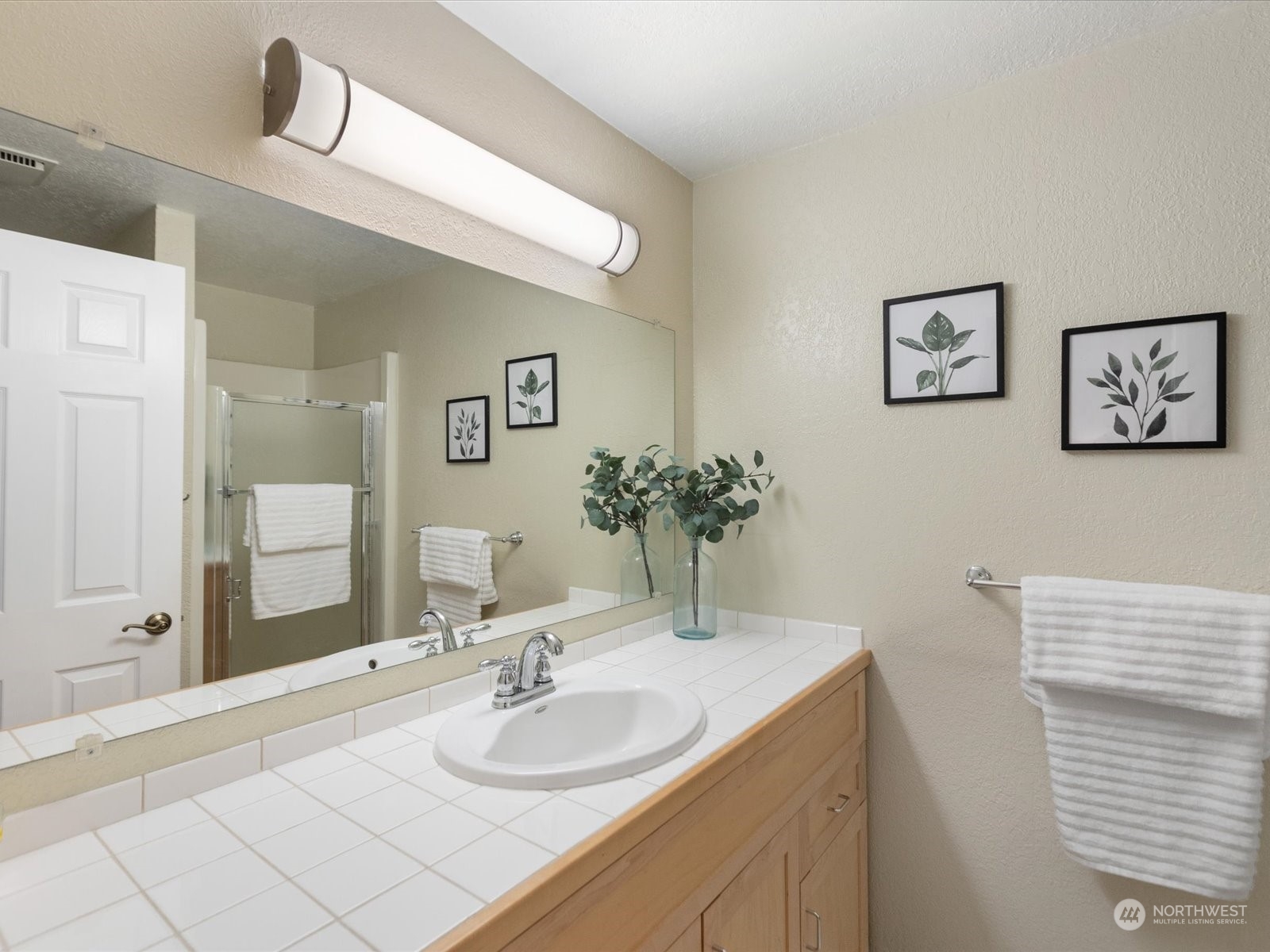 19124 27th Drive Southeast Bothell, WA 98012 - Photo 17 of 35 a bathroom with a sink and a mirror