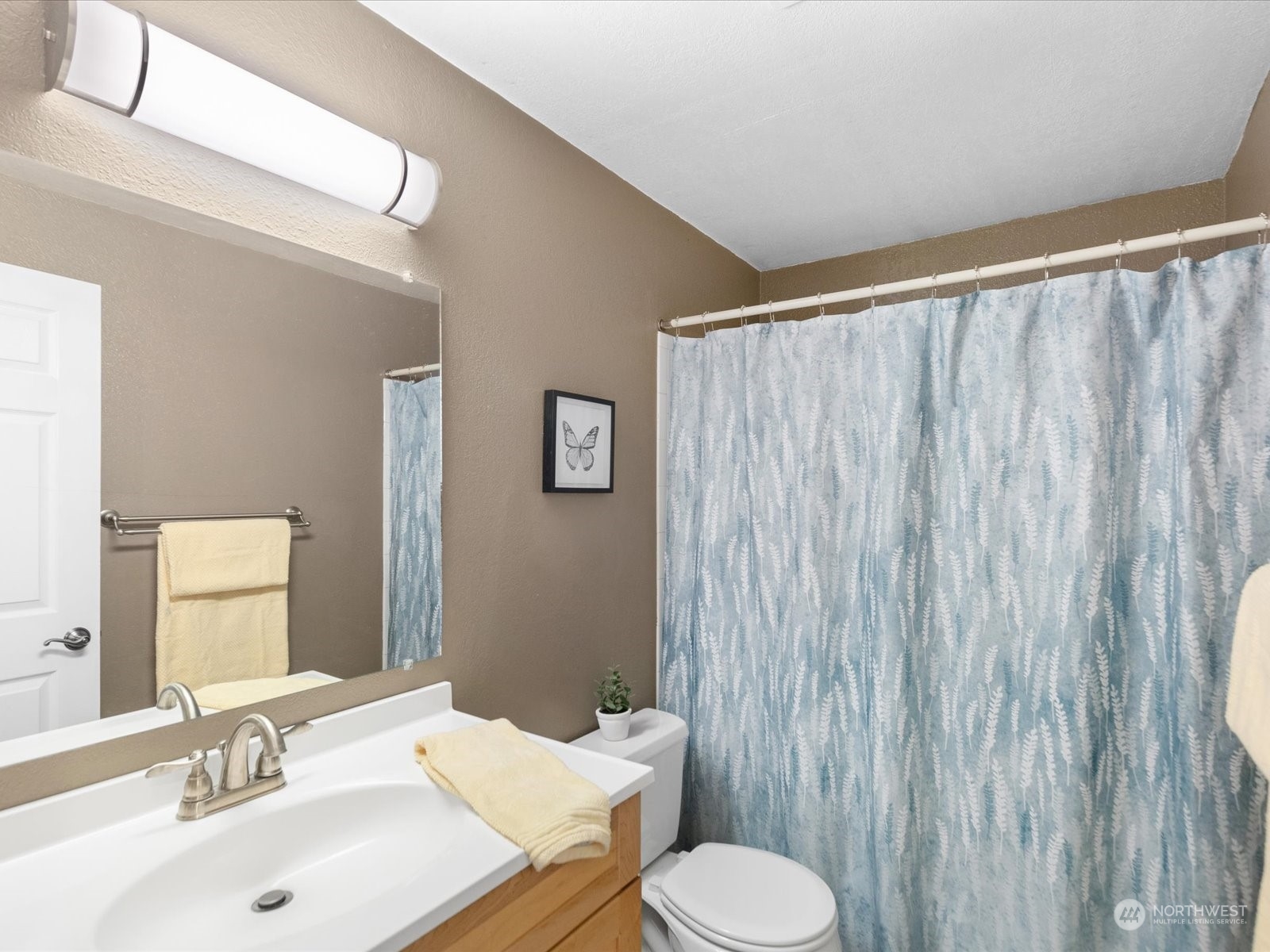 19124 27th Drive Southeast Bothell, WA 98012 - Photo 19 of 35 a bathroom with a sink and a mirror