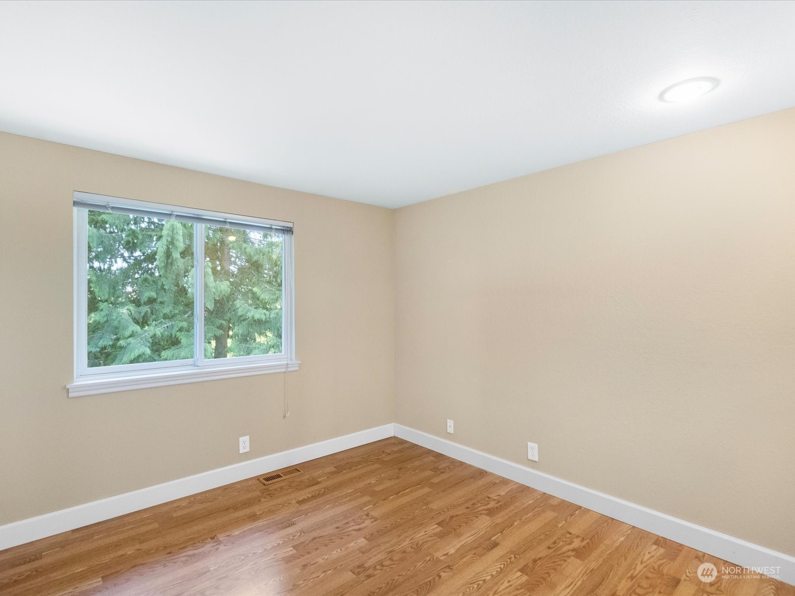 19124 27th Drive Southeast Bothell, WA 98012 - Photo 20 of 35 an empty room with wooden floor and windows
