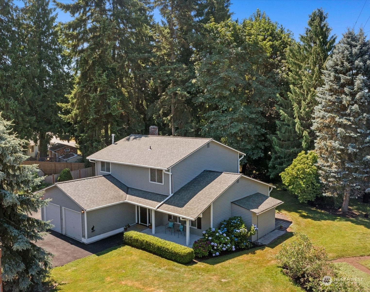 19124 27th Drive Southeast Bothell, WA 98012 - Photo 2 of 35 a aerial view of a house with a yard and large trees