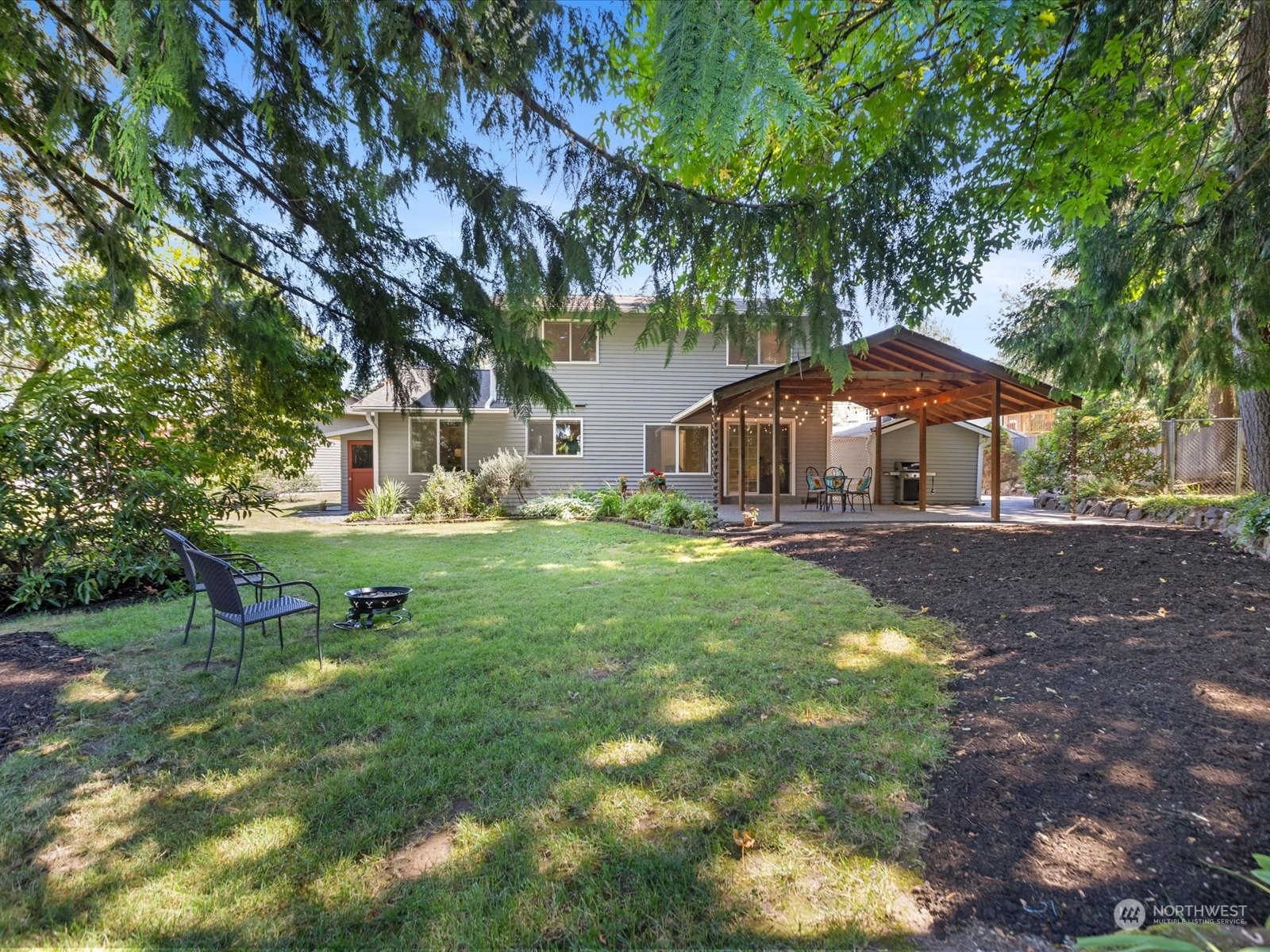 19124 27th Drive Southeast Bothell, WA 98012 - Photo 28 of 35 a view of a house with backyard and sitting area