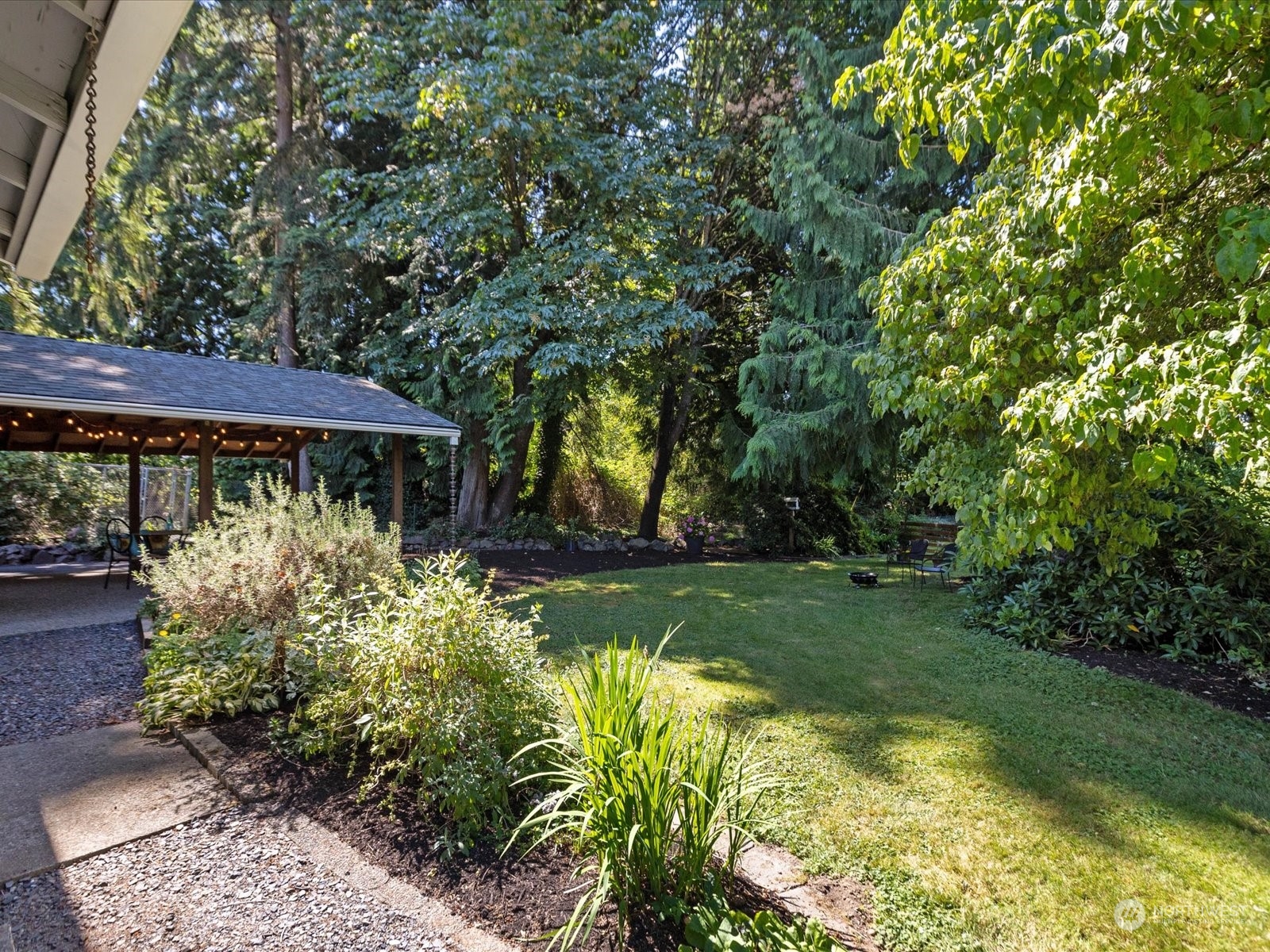 19124 27th Drive Southeast Bothell, WA 98012 - Photo 29 of 35 a view of a house with a big yard potted plants and large tree