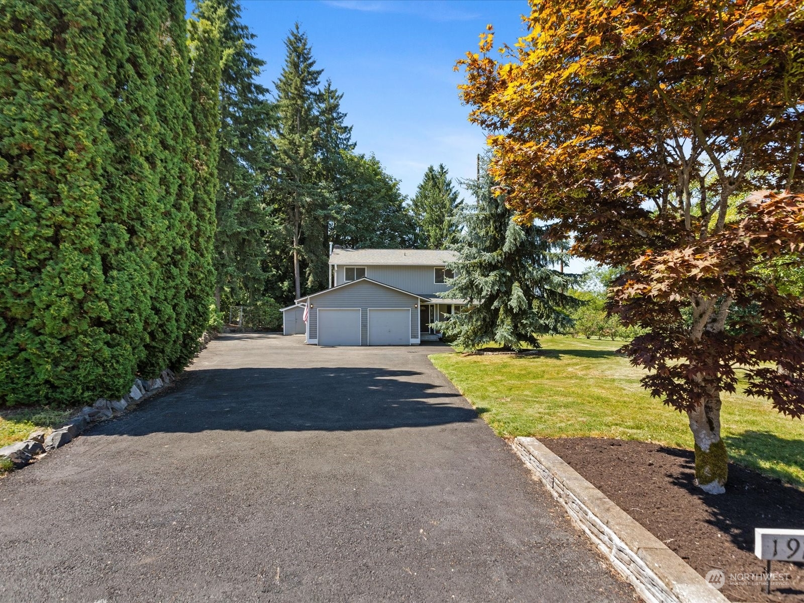 19124 27th Drive Southeast Bothell, WA 98012 - Photo 3 of 35 a view of a house with a yard and tree s
