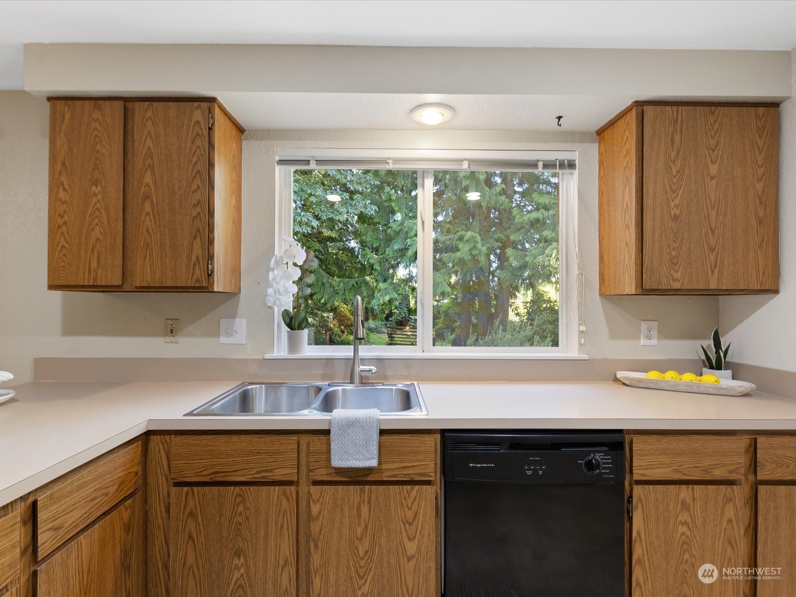 19124 27th Drive Southeast Bothell, WA 98012 - Photo 10 of 35 a kitchen with a sink a window and cabinets