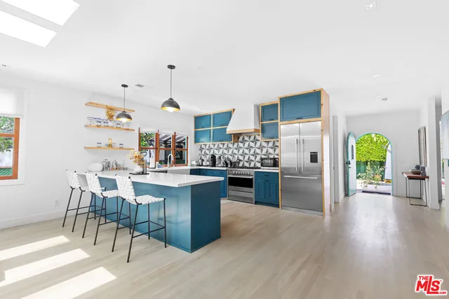 a kitchen with a table and chairs in it