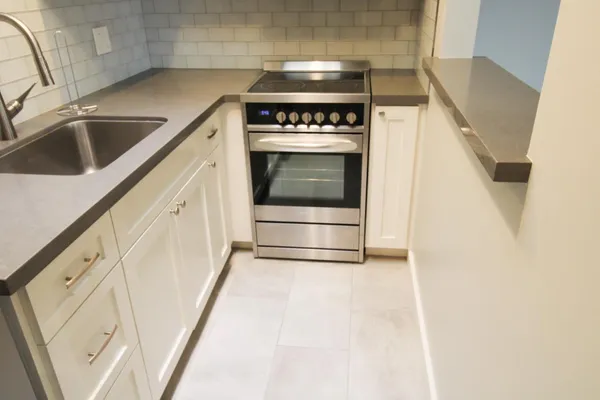 a kitchen with a stove and a sink