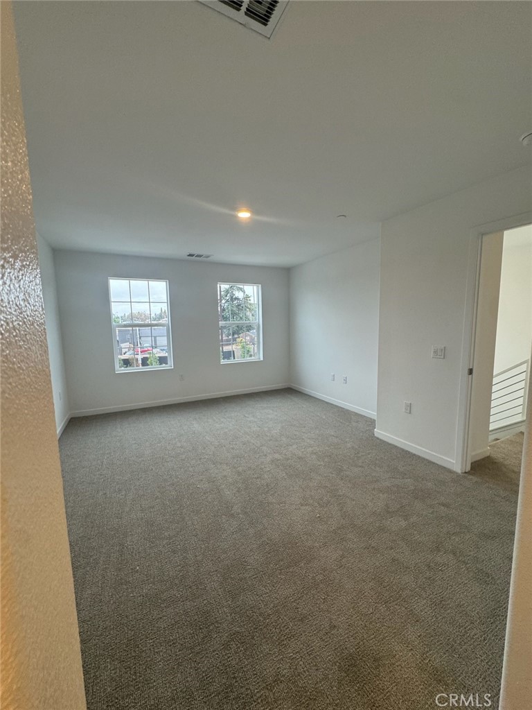 8315 Gabrielino Court Rancho Cucamonga, CA 91730 - Photo 16 of 27 an empty room with windows
