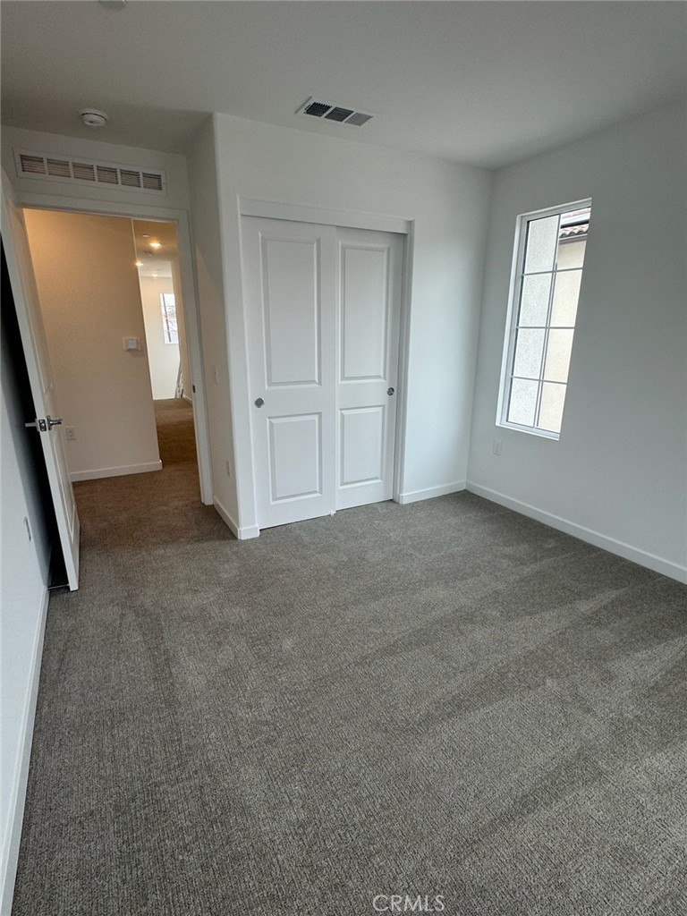8315 Gabrielino Court Rancho Cucamonga, CA 91730 - Photo 20 of 27 an empty room with windows and closet