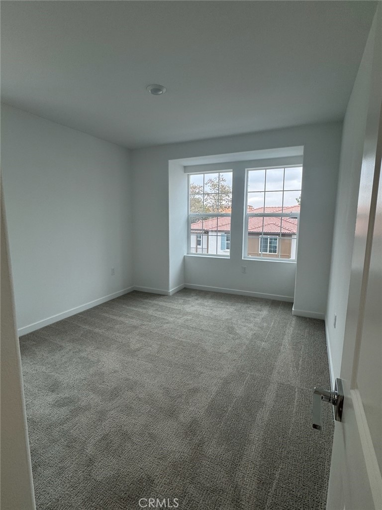 8315 Gabrielino Court Rancho Cucamonga, CA 91730 - Photo 21 of 27 an empty room with windows