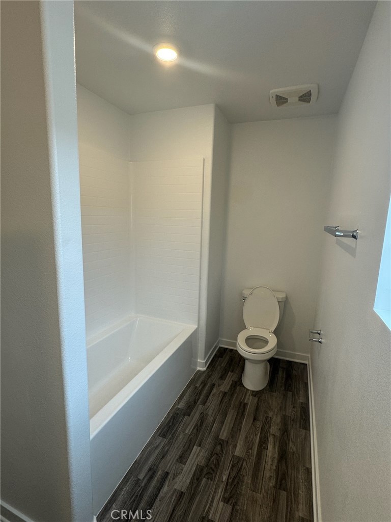 8315 Gabrielino Court Rancho Cucamonga, CA 91730 - Photo 22 of 27 a bathroom with a toilet and a bathtub