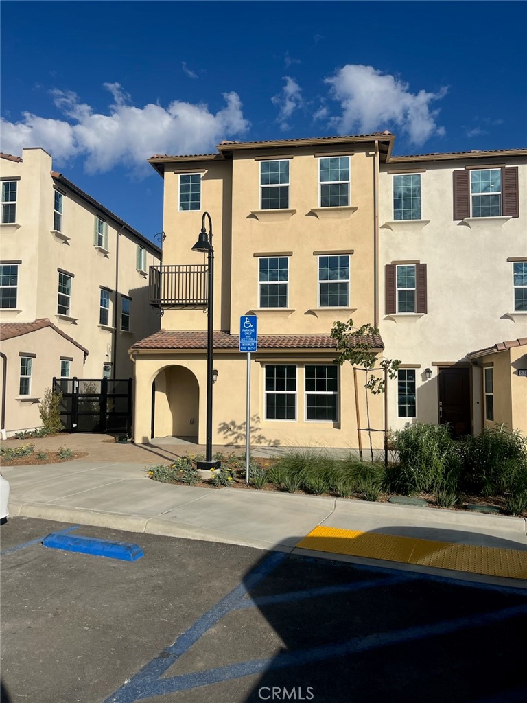 8315 Gabrielino Court Rancho Cucamonga, CA 91730 - Photo 3 of 27 a front view of a building with swimming pool