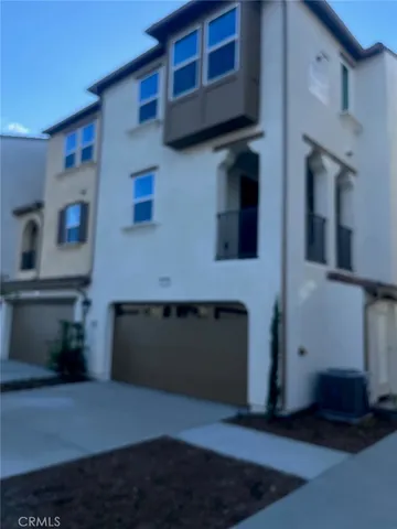 a front view of a house with a garage