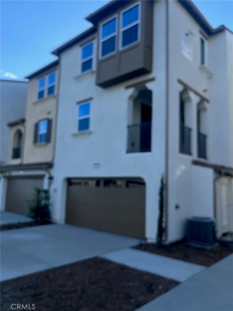 8315 Gabrielino Court Rancho Cucamonga, CA 91730 - Photo 4 of 27 a front view of a house with a garage