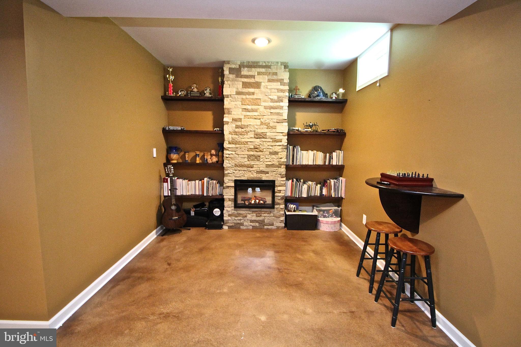 15221 Londons Bridge Road Haymarket, VA 20169 - Photo 34 of 44 Basement entertainment area with electric fireplac