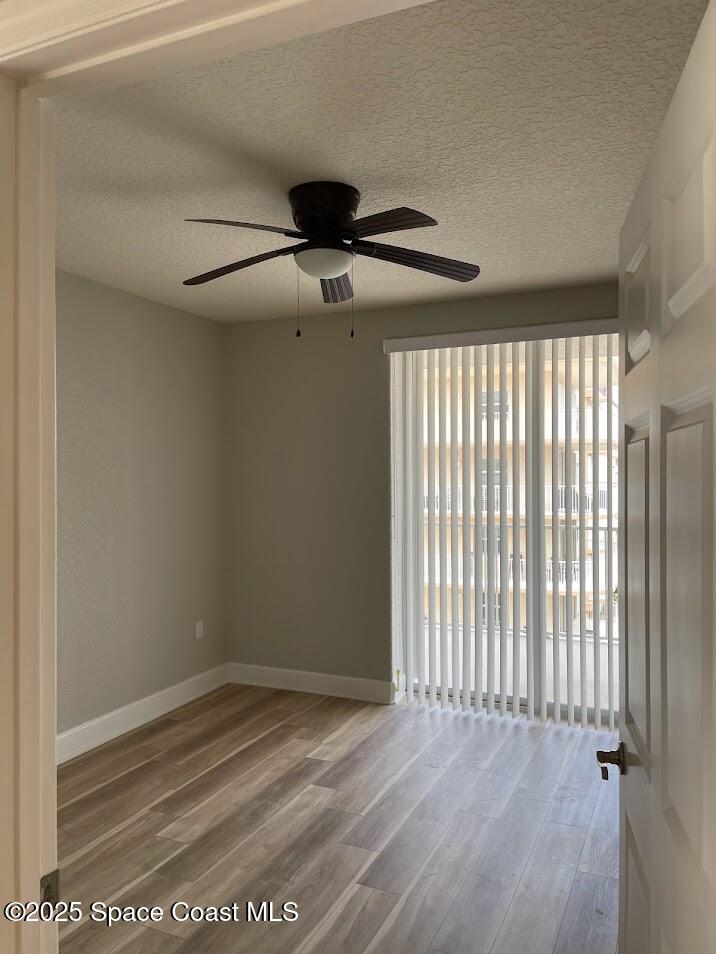 817 Mystic Drive, Unit B410 Cape Canaveral, FL 32920 - Photo 16 of 28 a view of an empty room with a window